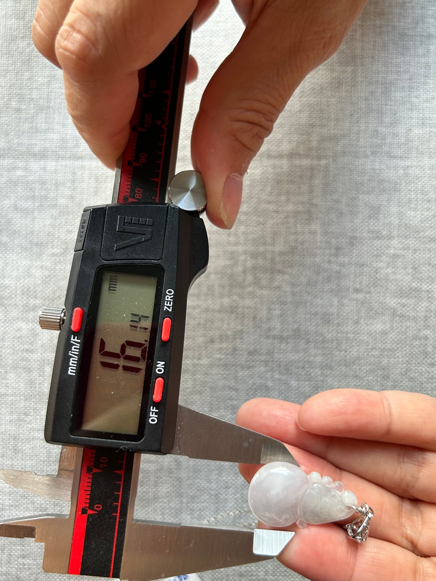 A Natural Burma Icy Green Jadeite Wu Lu (Gourd) pendant with  silver bail necklace