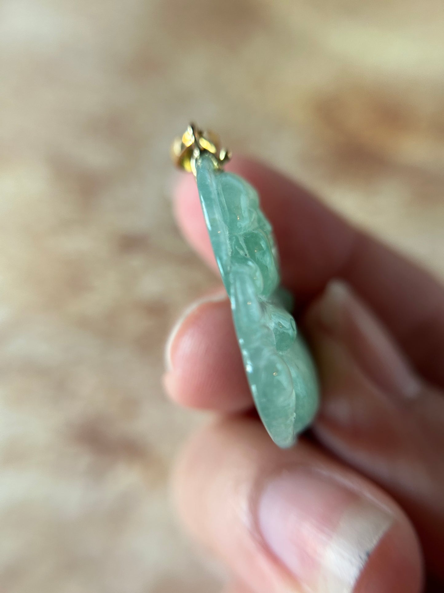 Icy green jadeite Buddha pendant with 18k yellow gold bail