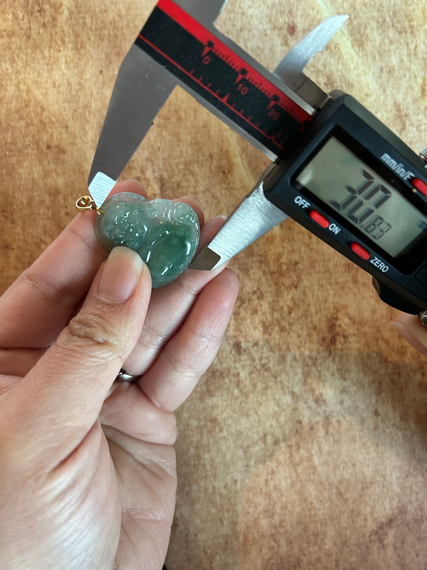 Icy green jadeite Buddha pendant with 18k yellow gold bail