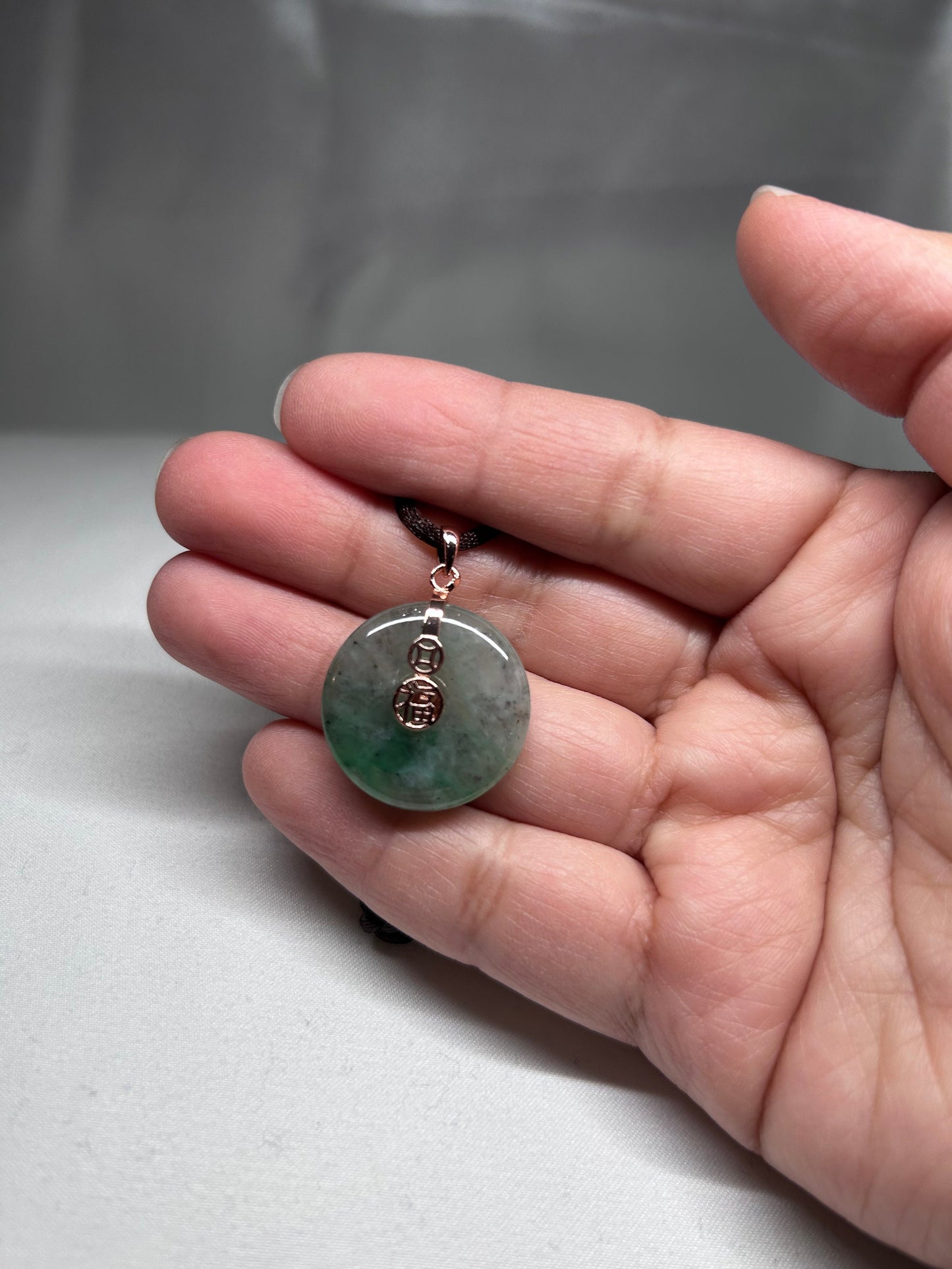 Grade A Natural Icy green Burmese jadeite donut ( ping on kou) pendant on rose gold plated sterling silver bail