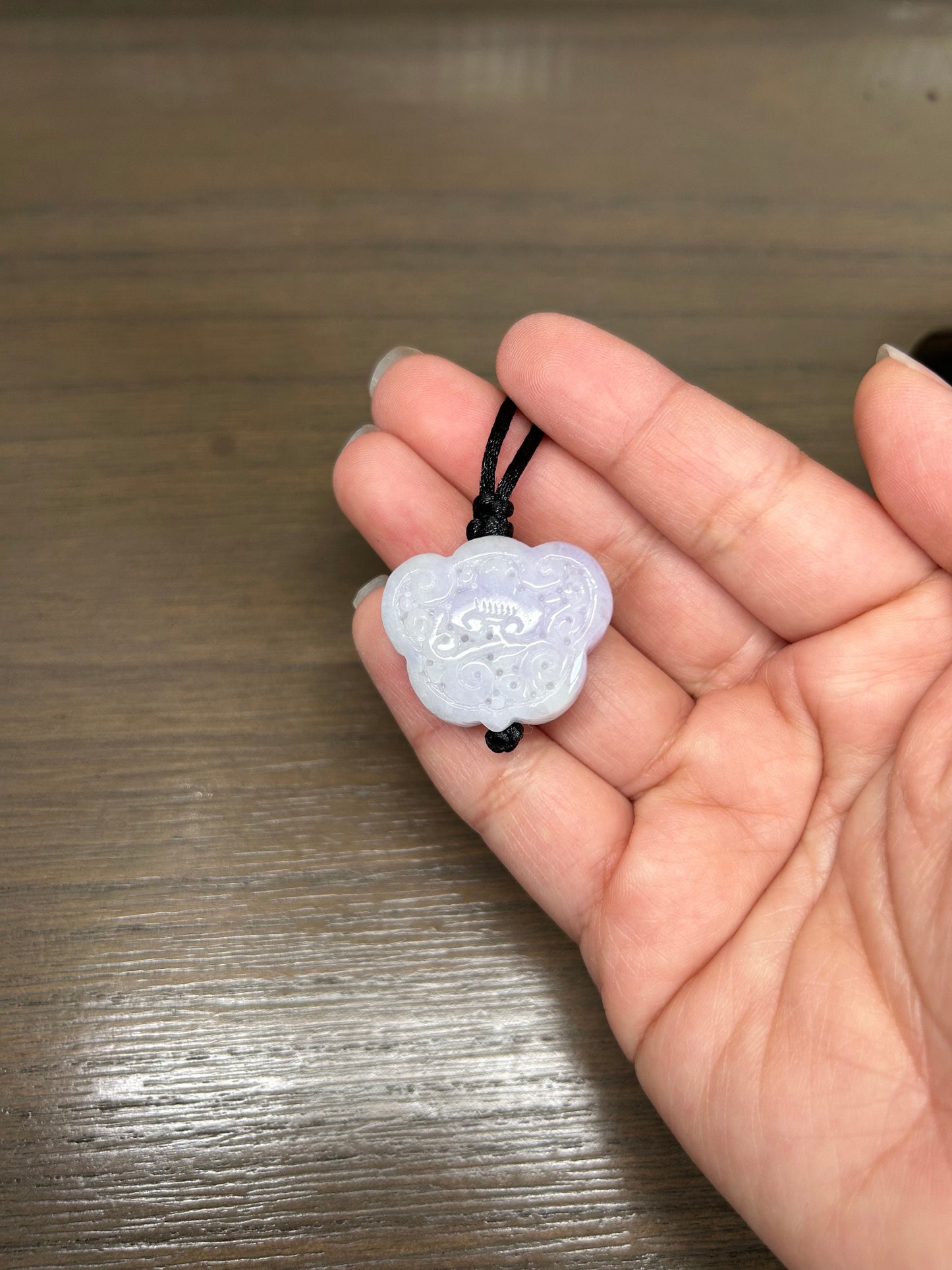 Grade A Natural Burma Jadeite Hand carved lavender Yuyi (ruyi) pendant on a black lanyard
