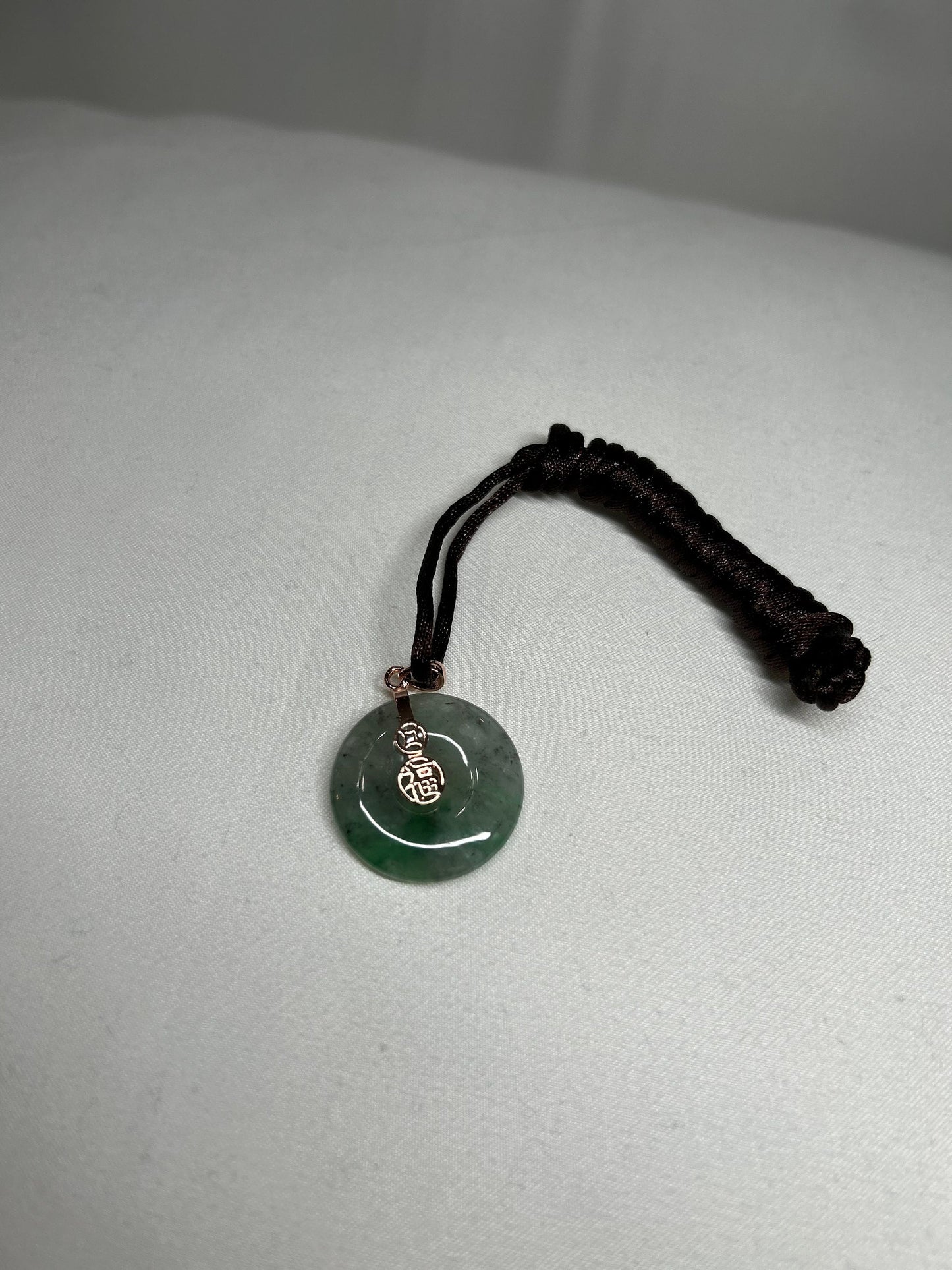 Grade A Natural Icy green Burmese jadeite donut ( ping on kou) pendant on rose gold plated sterling silver bail