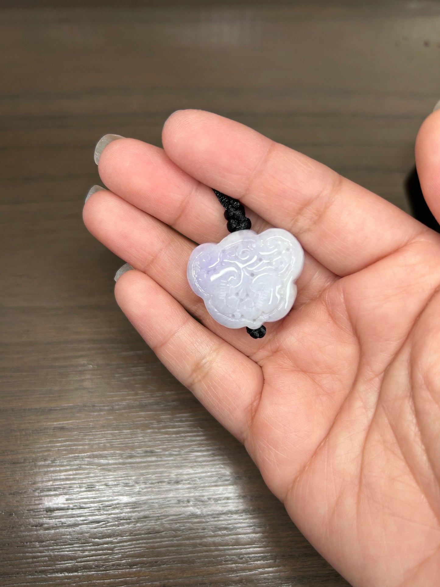 Grade A Natural Burma Jadeite Hand carved lavender Yuyi (ruyi) pendant on a black lanyard