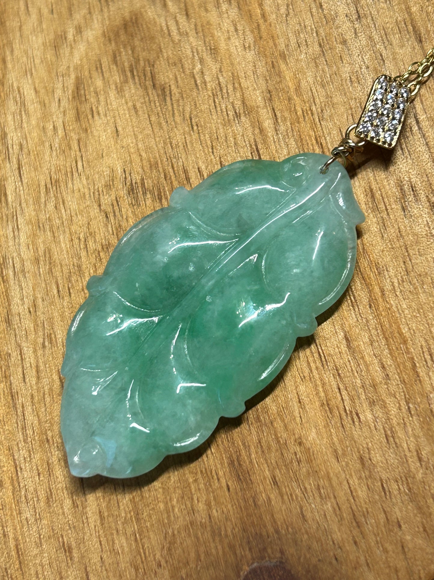 Grade A Natural Icy green Burma Jadeite pendant with double sided hand carved with leaf gold over sterling silver bail pendant