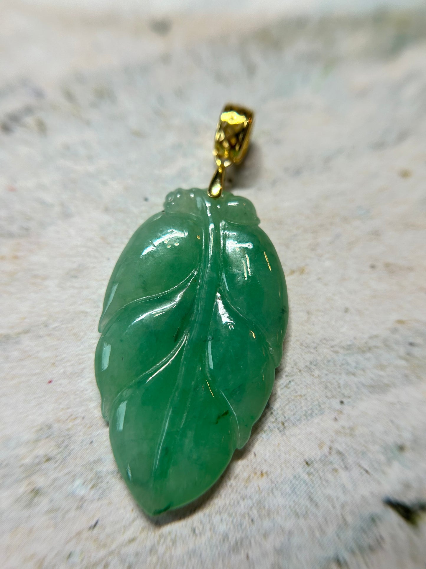 Grade A Natural Icy green Burma Jadeite pendant with double sided hand carved with leaf gold over sterling silver bail pendant