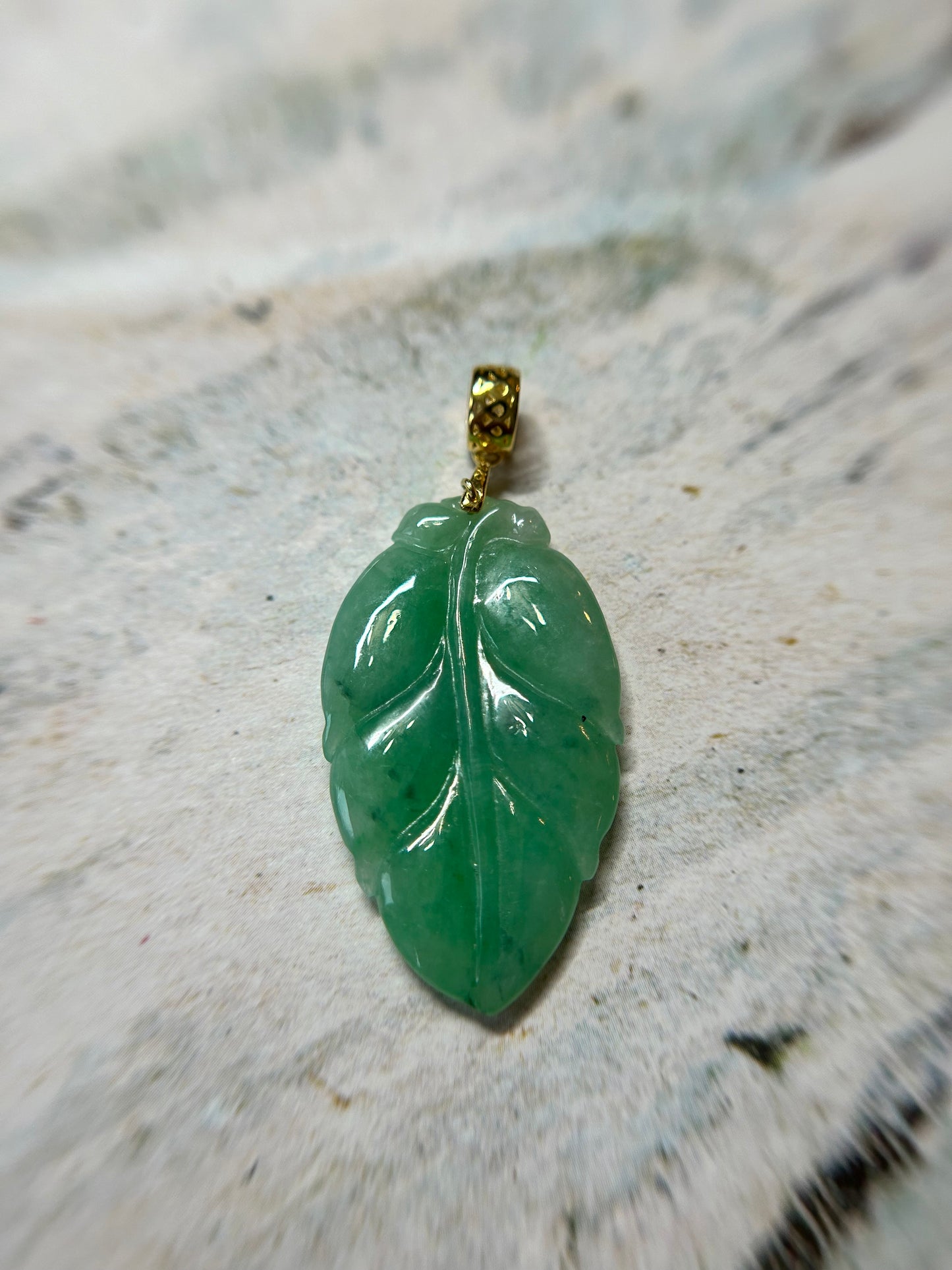 Grade A Natural Icy green Burma Jadeite pendant with double sided hand carved with leaf gold over sterling silver bail pendant