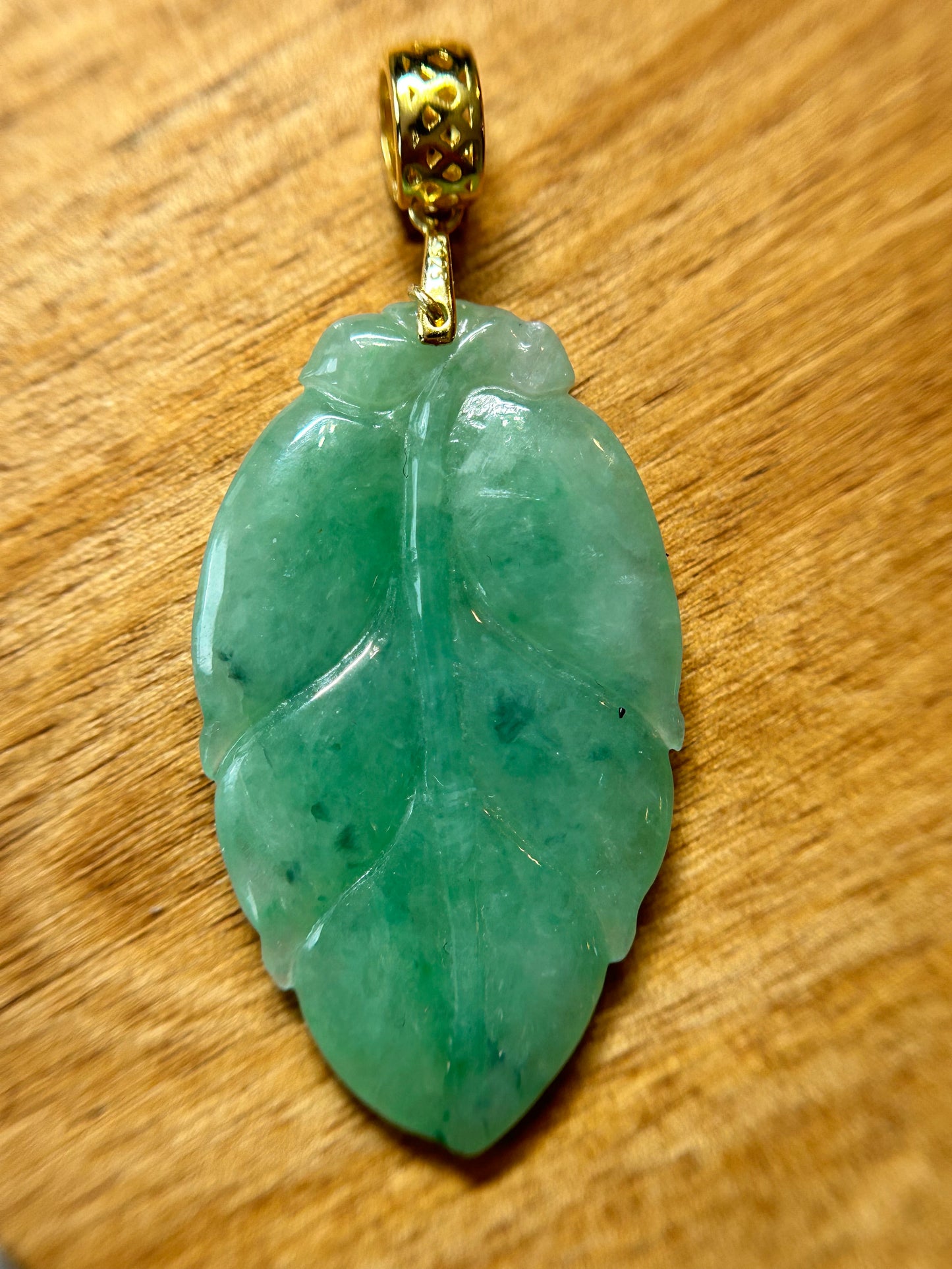 Grade A Natural Icy green Burma Jadeite pendant with double sided hand carved with leaf gold over sterling silver bail pendant