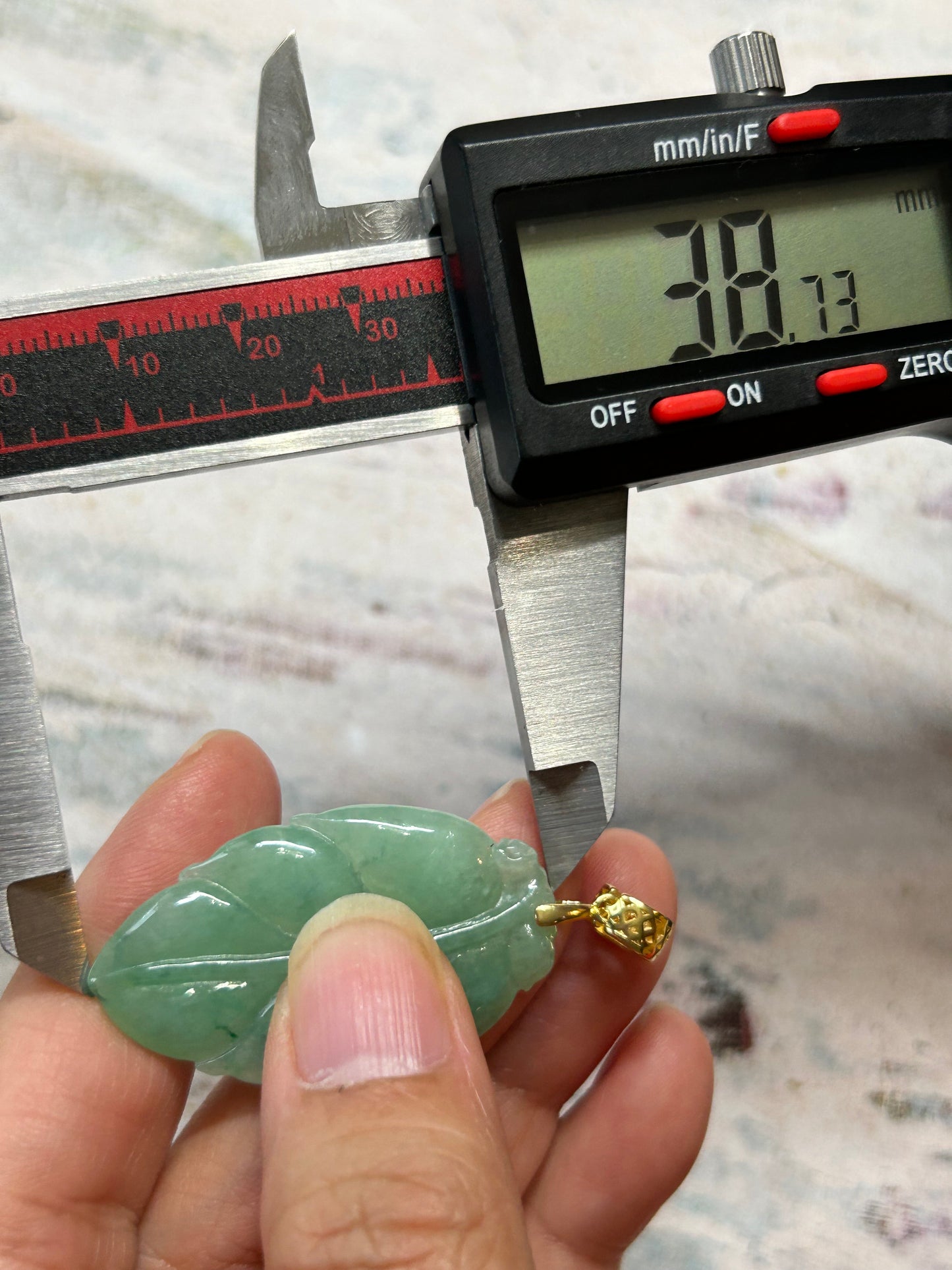 Grade A Natural Icy green Burma Jadeite pendant with double sided hand carved with leaf gold over sterling silver bail pendant