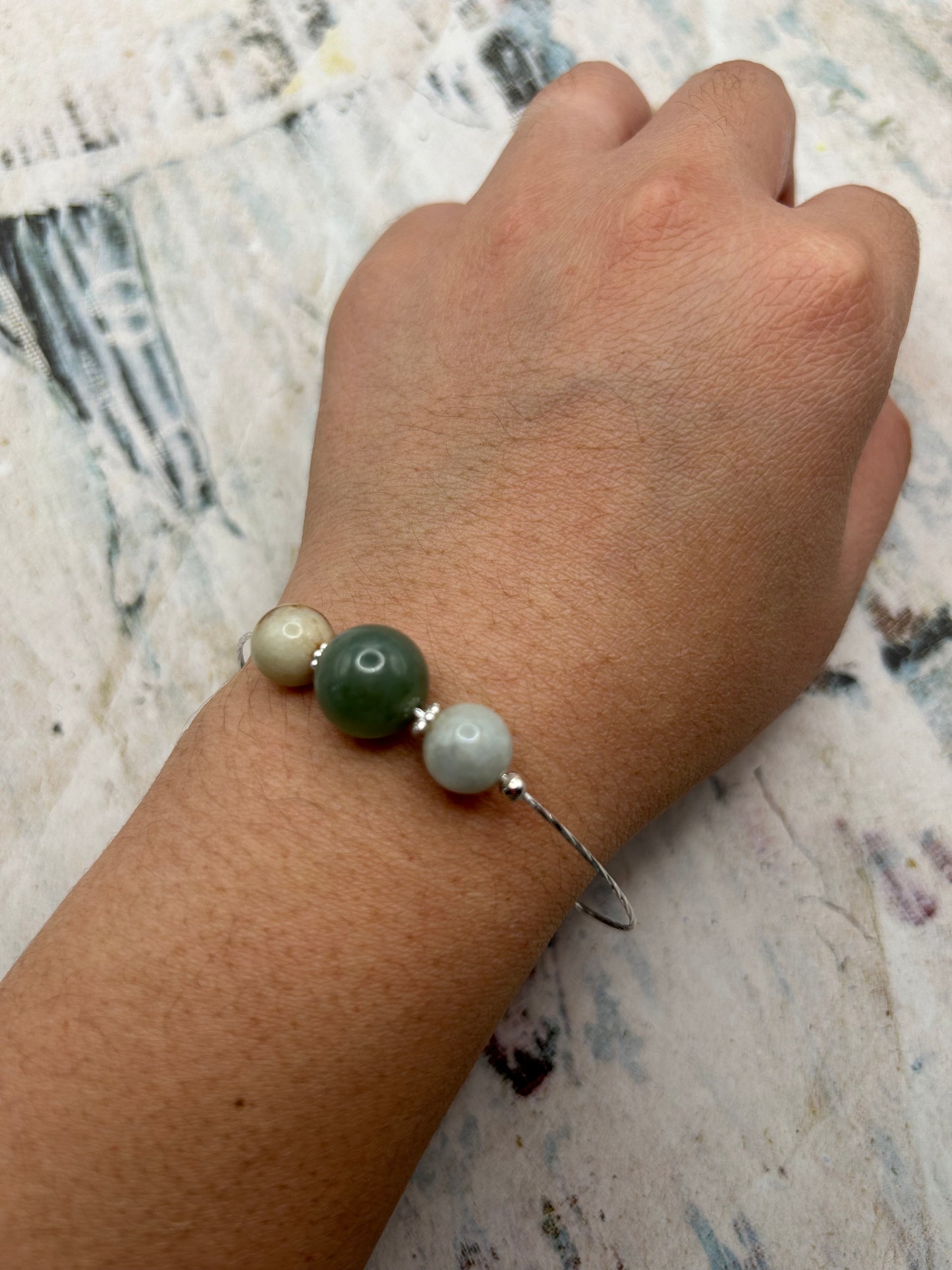 Grade A Natural Green and Beige Burmese Jadeite beads on a sterling silver bracelet