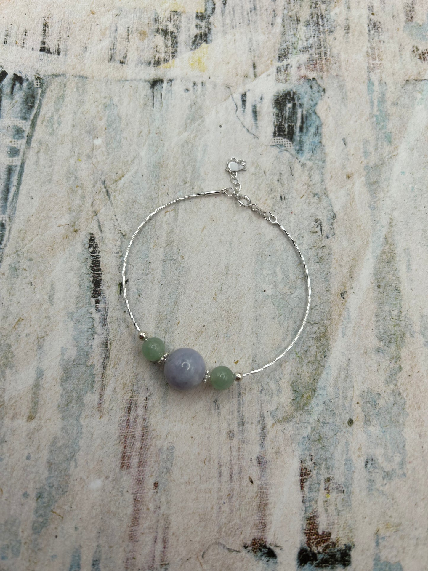 Grade A Natural Lavender and Green Burmese Jadeite beads on a sterling silver bracelet