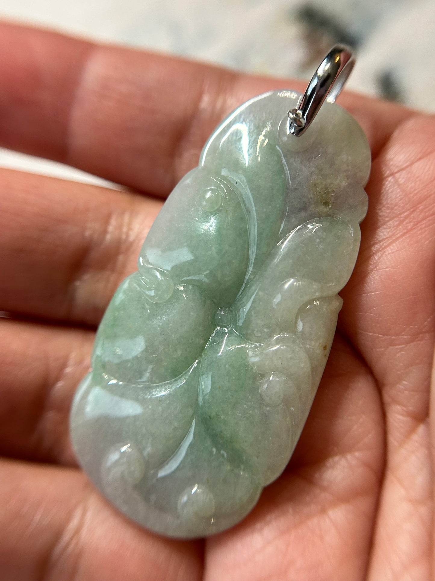 Grade A Natural Icy green and lavender Burma Jadeite pendant with double sided hand carved with fish and flower