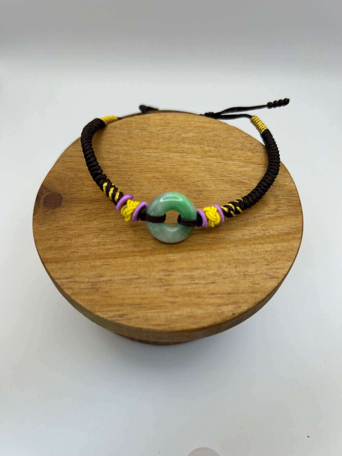 Grade A Natural Icy Green Burma Jadeite braided with black ,yellow and violet rope details Adjustable Bracelet