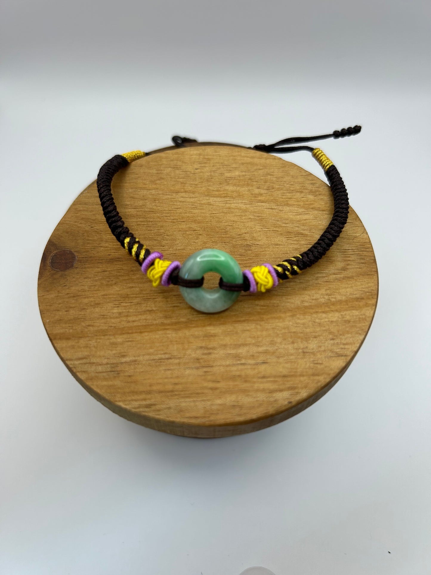 Grade A Natural Icy Green Burma Jadeite braided with black ,yellow and violet rope details Adjustable Bracelet