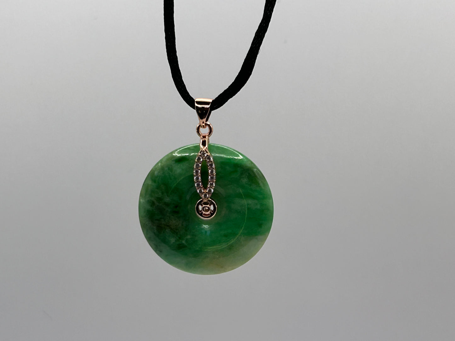 Grade A Natural Icy Green Jadeite  With Rose gold over Sterling Silver bail