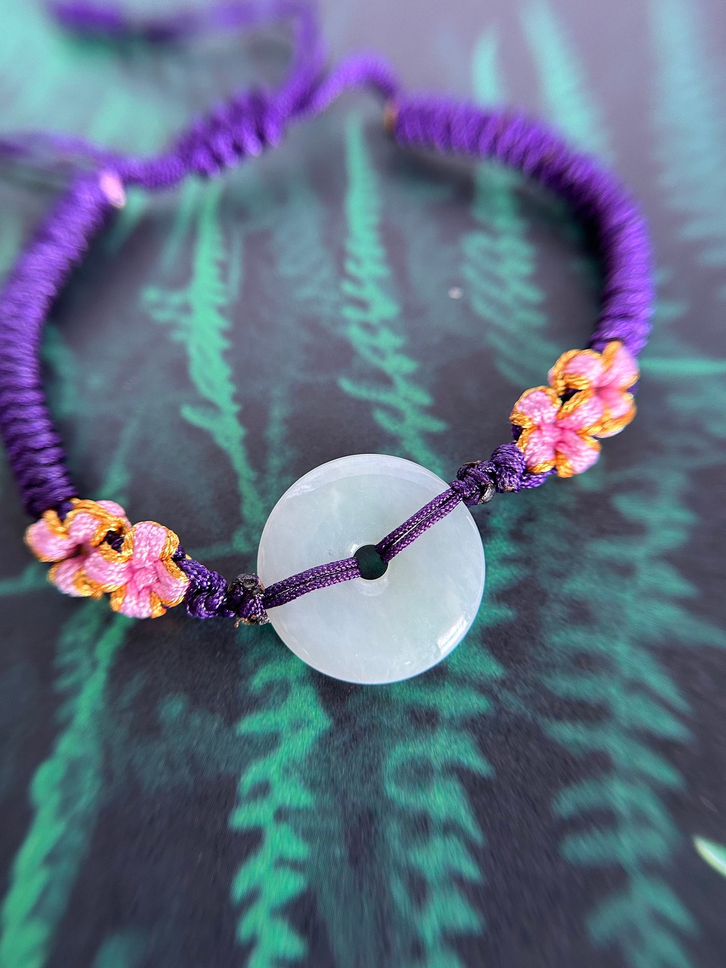 Grade A Natural Icy Green Burma Jadeite braided with purple, yellow, and pink rope details Adjustable Bracelet