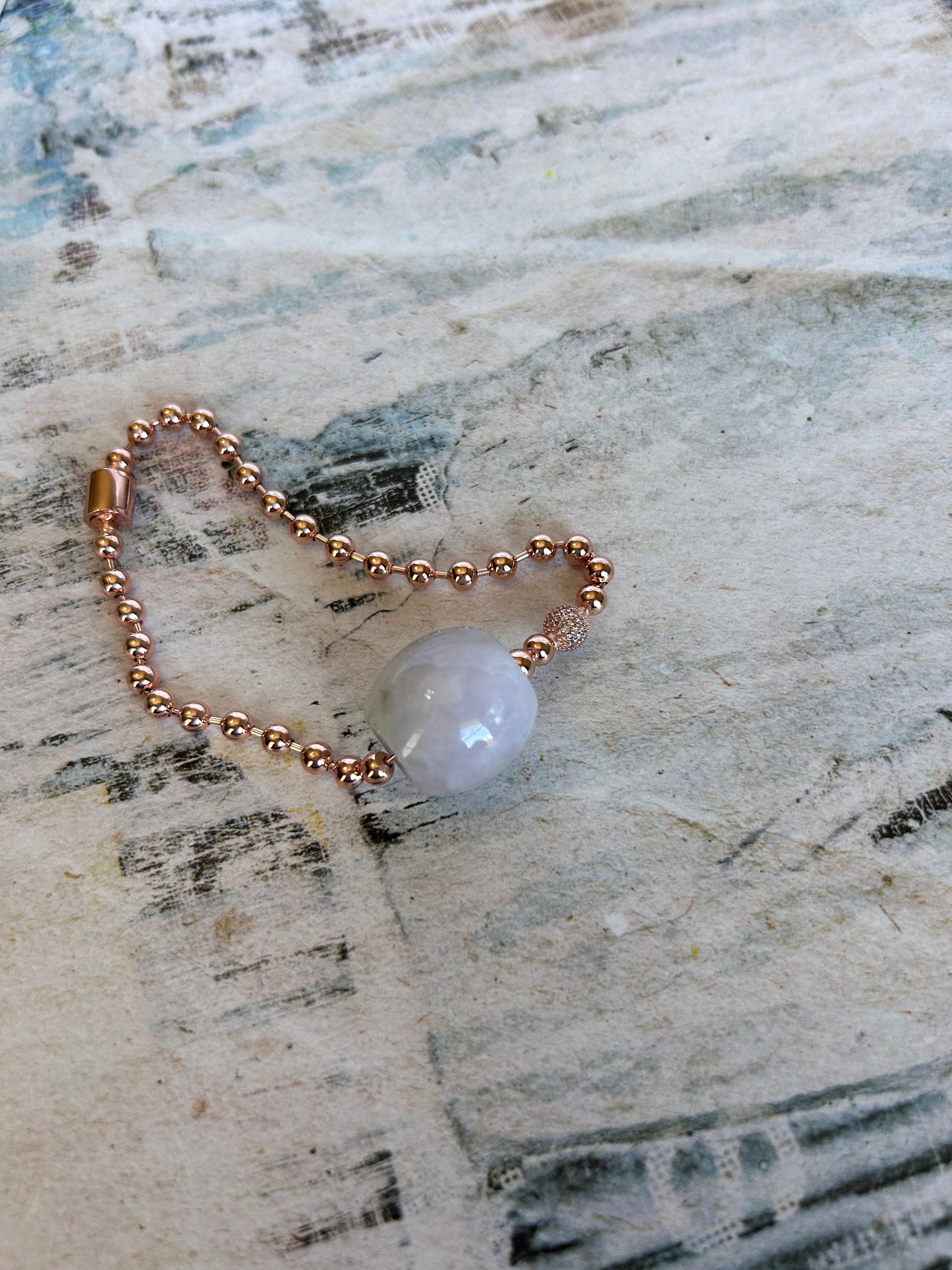 Grade A Natural light lavender Lu Lu Tong(barrel) with rose gold plated Sterling silver bracelet.