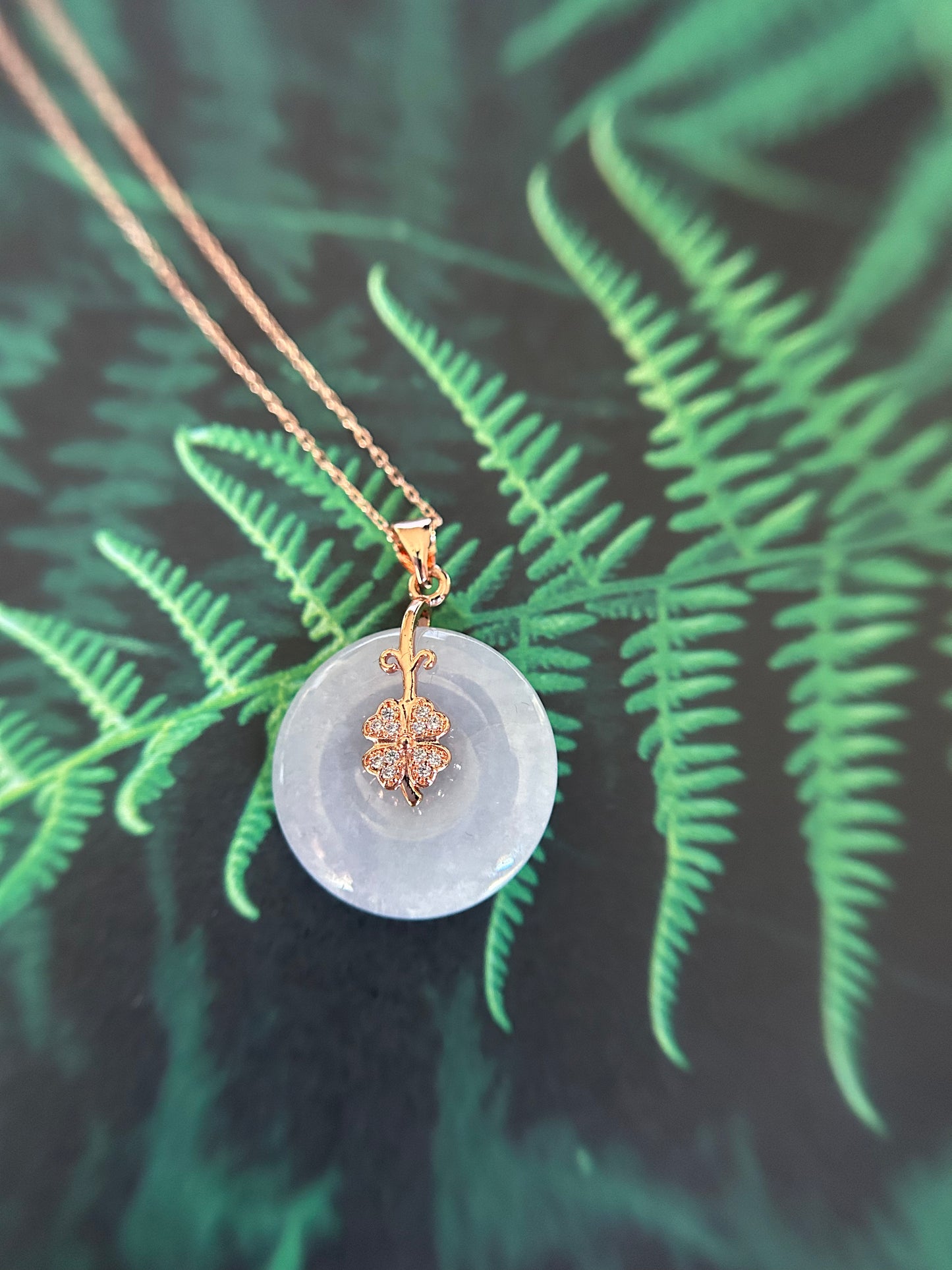 Grade A Natural Burma lavender Jadeite Pi Disc (peng on kou, donut) pendant with a sterling silver, rose gold plated four leaves clover bail