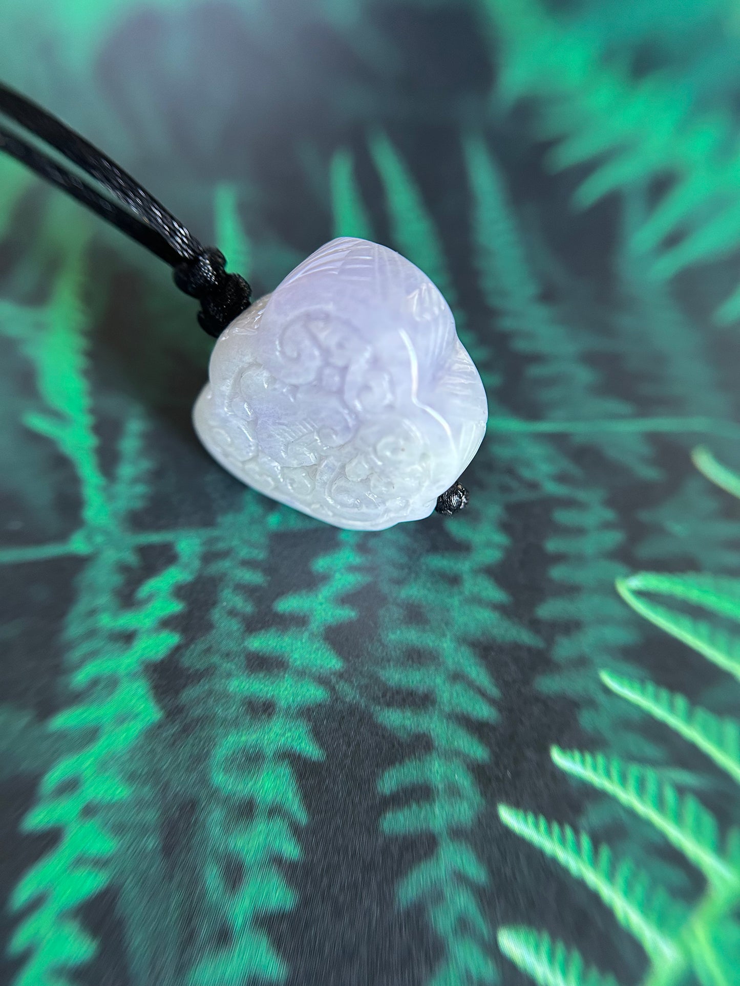 Grade A Natural Burma Jadeite Hand carved lavender Yuyi (ruyi) pendant on a black lanyard